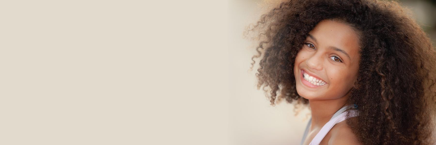 girl smiling before a dental appointment in palos heights Illinois