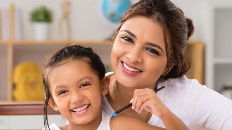 A mother and daughter smiling | Pediatric dentist