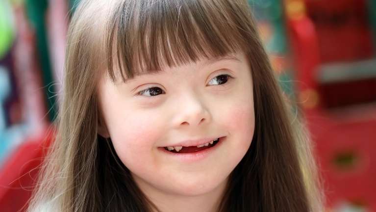 Special needs child smiling | special needs dentist