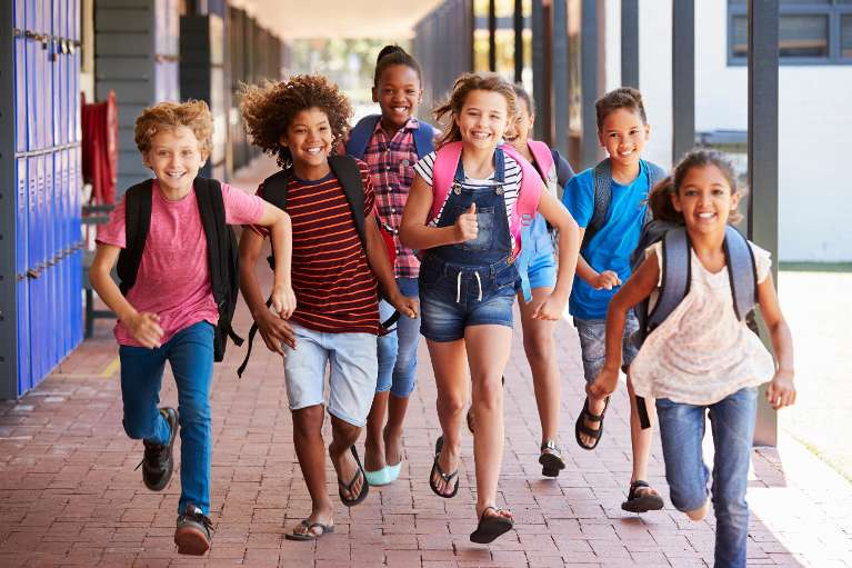 Kids running outside of a school, palos heights il