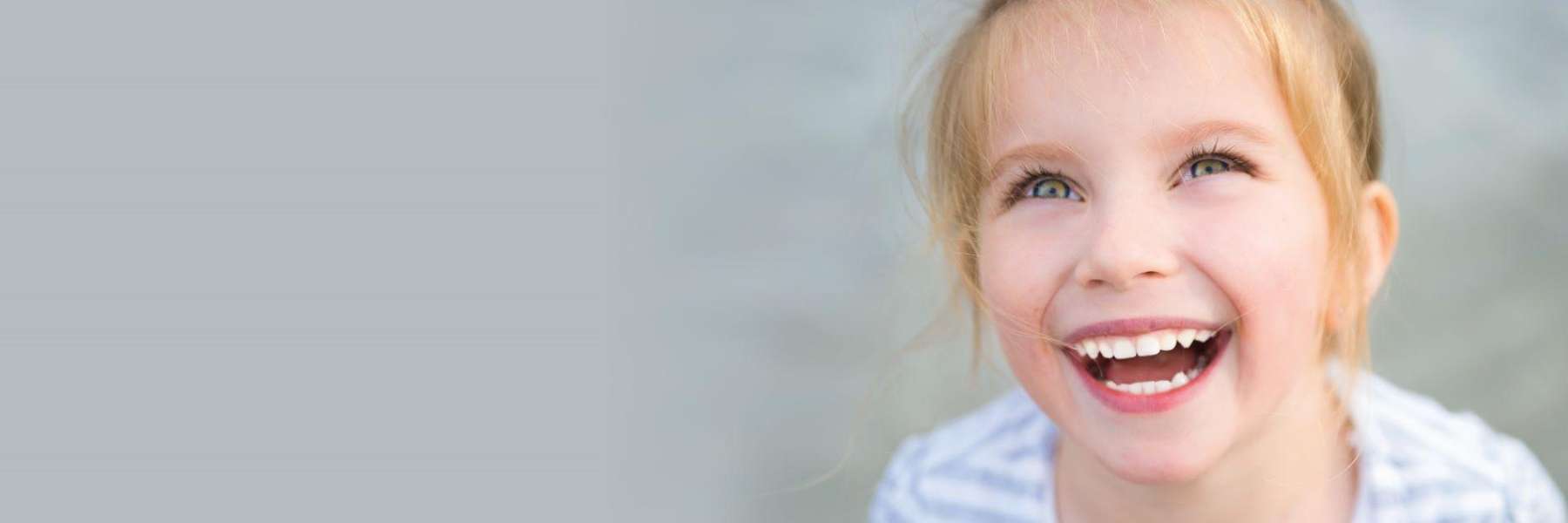 Young girl smiling after pediatric dental care, palos heights IL