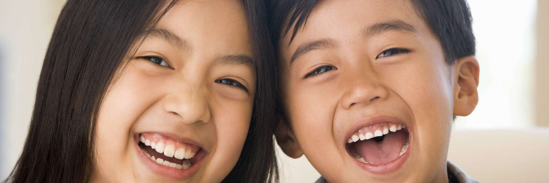 Sibling children laughing